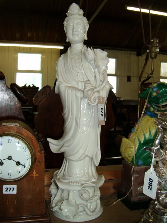 Sancai-glazed lion dog table lamp & a large blanc de chine figure of Guanyin(-)